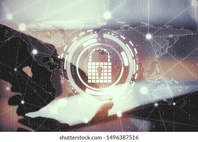 Close up of hands using tablet with creative glowing digital padlock interface on blurry background with icons. Safety and protection concept. Multiexposure