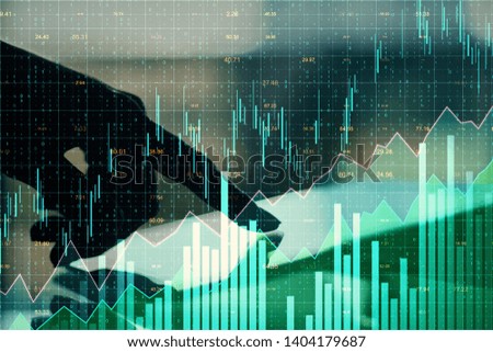Close up of hands using tablet with glowing forex chart on blurry background. Invest and stats concept. Multiexposure 