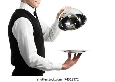 Close Up Hands Of Waiter With Metal Cloche Lid Cover