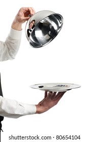 Close Up Hands Of Waiter With Restaurant Metal Cloche Lid Cover