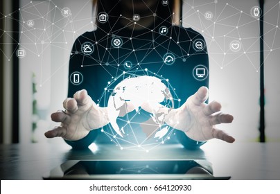 Close up hand's woman over digital planet global connection with communication network application icon,  internet of things (IoT) and Digital era. Marketing 4.0