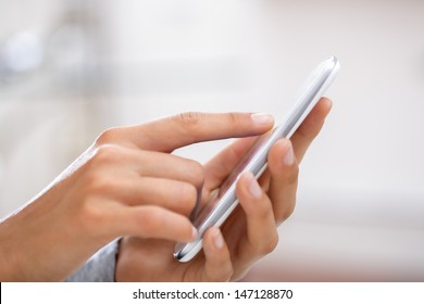 Close Up Of Hands Woman Using Cell Phone.
