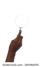 
Close Up Hands Of A Young African Black Woman Holding A Magnifying Glass On Studio Isolated White Background