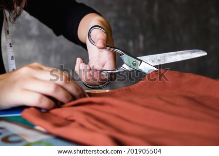 Similar – Image, Stock Photo Dressmaker cutting a cloth