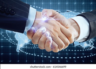 Close Up Of Handshake With Digital Pattern And Map. Global Partnership Concept