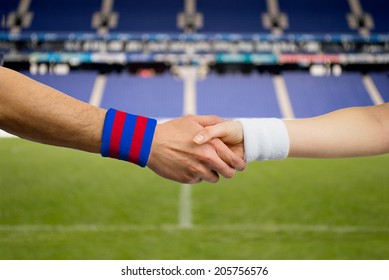 close up handshake of spanish match between Barcelona and Madrid - Powered by Shutterstock