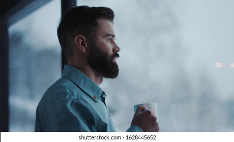 Close Up Handsome Businessman Drinking Coffee And Admire View Standing By Window In Office Attractive Boss Enjoying Tea Looking Young Break Manager Executive Observing Relaxation View Slow Motion