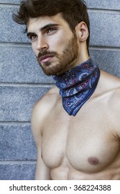 Close Up Of Handsome Man With Long Beard And Blue Scarf Around His Neck. 