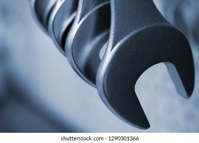 Close up of hanging wrenches. Space for text.