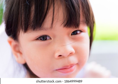 Close Up Happy Asian Child Girl. Head Shot Kid Sweet Smiling. Sweet Eye. Children With Bangs Hair. Student Aged 3-4 Year Old.