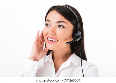 Close Up Of A Happy Asian Woman In White Shirt Wearing Headset With Microphone Isolated Over White Background