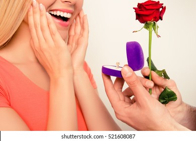 Close Up Of Happy Excited Girl. Her Boyfriend Making Proposal Of Marriage