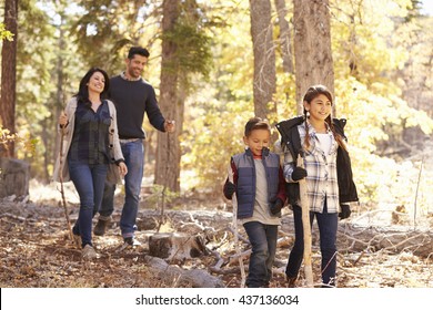 Close Up Of Happy Hispanic Family Hiking In Forest, Close Up