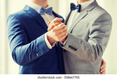 Close Up Of Happy Male Gay Couple Dancing