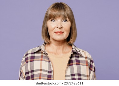Close up happy smiling cheerful fun elderly gray-haired woman 50s years old wear beige t-shirt shirt casual clothes looking camera isolated on plain pastel light purple background. Lifestyle concept - Shutterstock ID 2372428611