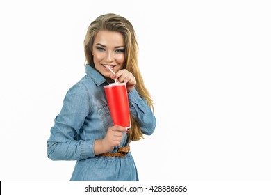 Close Up Of Happy Woman Drinking Cola From Plastic Red Cup With Straw Isolated, Beautiful Crazy Smiling Blonde Lady In Casual Blue Hipster Summer Clothes, Drinks