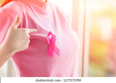 Close up Happy woman with a pink ribbon  for  Prevention Breast cancer or  Breast Cancer Awareness Concept. - Shutterstock ID 1177573789