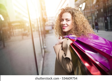 Close up of a happy woman shopping. - Shutterstock ID 534609754