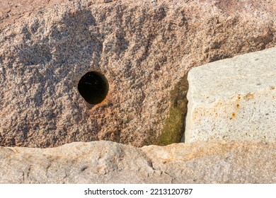 Close Up Of The Harbor's Rocks Used To Build The Dike In Plymouth Massachusetts Harbor.