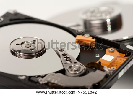 close up of hard disk with blurred another hard disk in background