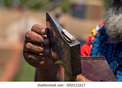 Close Up Of The Head Of An Axe Being Held By An Aboriginal Elder In A Wood Chopping Event At A Country Show