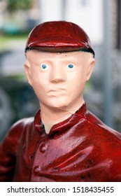 Close Up Of Head Of Caucasian Lawn Jockey With Startled Expression.