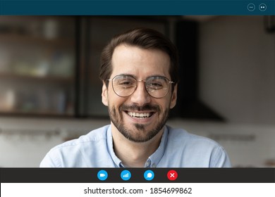 Close up head shot computer application screen view happy 30s bearded man in eyeglasses holding video call funny talk with friends, entertaining enjoying online distant communication alone at home. - Powered by Shutterstock