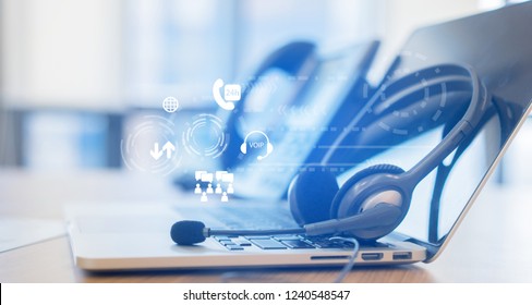 Close Up Headphone Of Call Center With Telephone Answer Machine On Table At Operation Room With Virtual Circle Wheel Business Technology Interface For Telecommunication Engineering Concept