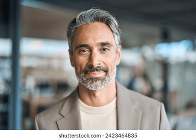 Close up headshot portrait of happy middle aged older professional business man, smiling bearded mature executive ceo manager, older male entrepreneur, rich confident business owner in office.