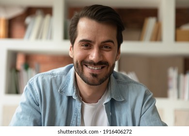 Close up headshot portrait of smiling young Caucasian man talk speak on video call. Profile picture screen view of have webcam digital virtual conference or event online. Communication concept.