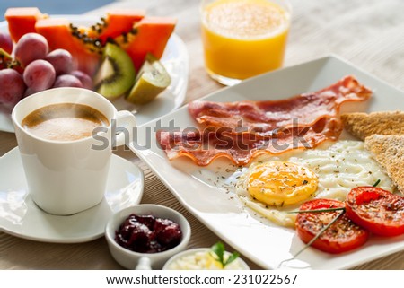 Close up of healthy continental breakfast with fresh fruit and ground coffee.