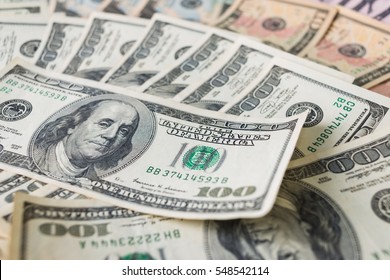 Close up heap of one hundred dollars, selective focus. Dollars, the us money background.