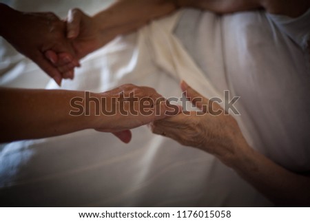 Close up of helping hands.