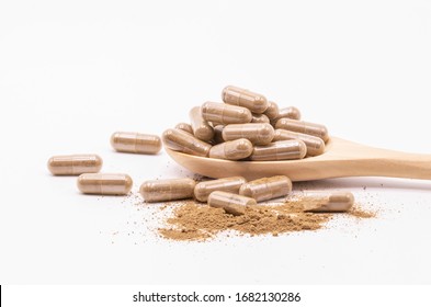 Close up herbal capsules isolate on white background.