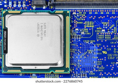 Close up of High performance CPU or central processor unit on electronic board background.