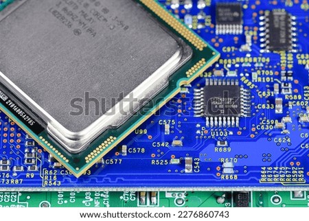 Close up of High performance CPU or central processor unit on electronic board background.