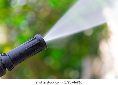 Close Up Of High Pressure Water Nozzle On Green Nature Background