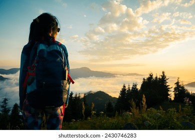 Close up hiker brunette Caucasian woman watch enjoy sunset above clouds in Adjara on solo hike trail outdoors in country of Georgia - Powered by Shutterstock