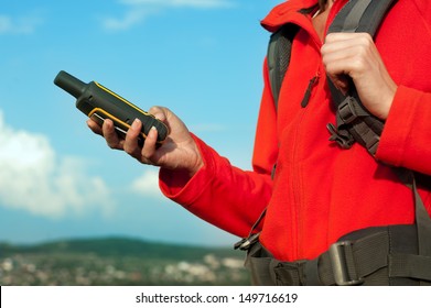 Close Up Of Hiker Young Woman Holding In Her Hand GPS Navigator, Global Positioning System Device