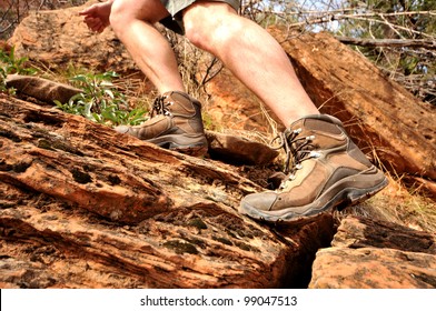 Close up of hiking boots and legs climbing up rocky trail - Powered by Shutterstock