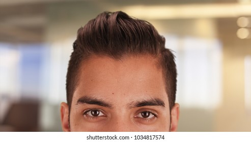 Close Up Of Hispanic Man With Cool Undercut Standing In Office