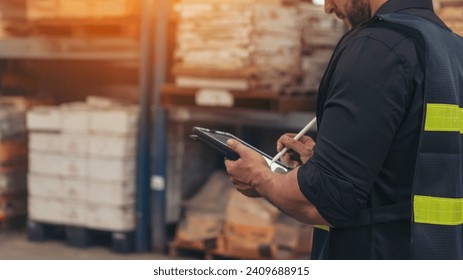 Close up Hispanic men hands using pen touch smart tablet Warehouse management logistics counting checking products on inventory shelf. Man hands worker check stock control in distribution storage
