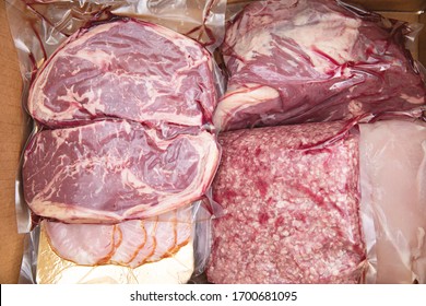 Close up of home delivery of fresh cryovac packed meat