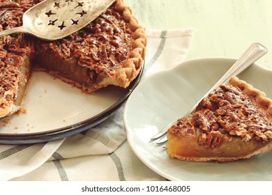 Close Up Of Homemade Classic Pecan Pie And A A Slice On Plate, Selective Focus / Pi Day Background