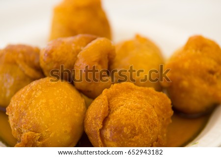 Close up of a homemade fritters with sugar and its ingredients