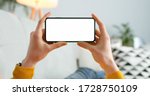 Close up of horizontal black smartphone with blank screen in woman hands. Mobile phone with blank copy space screen for your text