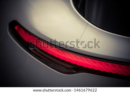 Close up horizontal image of the LED tail lights of a new sport super car.