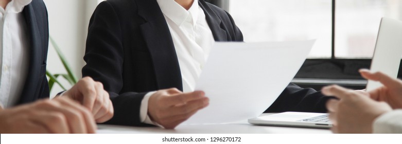 Close up horizontal photo hr manager female holding resume cv paper interviewing ask questions applicant vacancy candidate. Employment hiring first impression concept, banner for website header design
