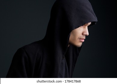 Close up horizontal portrait of a man with hooded sweatshirt 