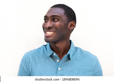 Close Up Horizontal Portrait Smiling Young Black Man Against Isolated White Background Looking Away